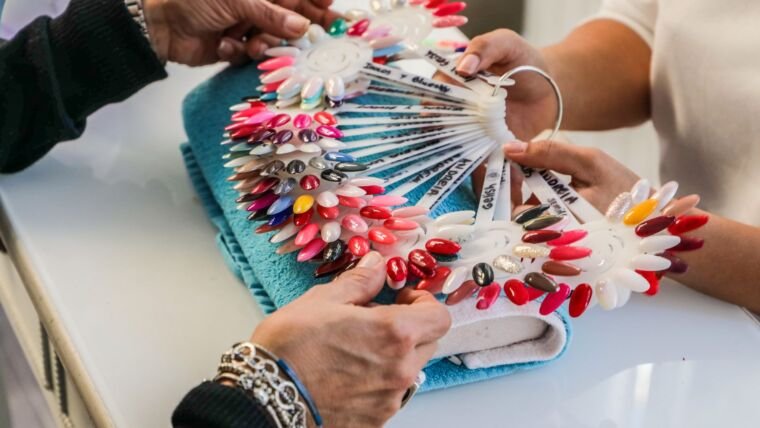 Diverse nail polish colors displayed in a salon for customer selection